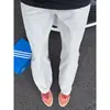 Pantalones transpirables de secado rápido perforados transfronterizos para hombre y mujer, nuevos pantalones casuales de verano con empalme de malla de seda helada, corte recto ajustado