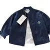 Camisa de Mezclilla Suave para Niños Otoño 2026 Nuevo Modelo Manga Larga para Niños y Niñas Camisa Chaqueta Oso Bebé Cuello Redondo