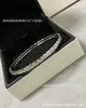 Pulsera Chanel versión estrecha y ancha patrón de rombos Coco finamente tallada versión alta sin diamantes incrustaciones de diamantes sensación de alta gama pulsera color oro arroz