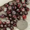 Joyería de cerámica Jingdezhen larga roja concubina imperial cuentas redondas agujero grande cuentas sueltas diy estudiantes niños bolsa de material hecho a mano