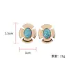 Pendientes Versátiles Retro de Lujo Ligero Transfronterizos 2025 con un Diseño Sencillo y de Nicho, Incrustados con Turquesa de Imitación, Venta al por Mayor