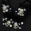 Borla de perla flor morada versátil primavera-verano zapato de madera decoración accesorios DIY hebillas de zapato y dijes para zapatos versátiles venta al por mayor