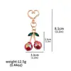 Comercio Exterior Popular Par de Bolso de Cristal de Cereza Roja Llavero con Purpurina Cadena de Bolso para Mujer de Gama Alta Cierre Doble Colgante