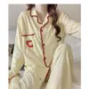 Cardigan de punto de imitación de algodón de alta densidad para principios de otoño, conjunto de pijama de manga larga y pantalón largo para mujer con copas en el pecho, ropa de casa linda, transfronterizo