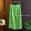 Saia Estilo Chinês 2026 Primavera Nova Saia Midi de Cintura Alta com Corte que Cobre a Barriga e Design Abotoado