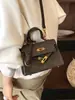 Bolsa de mão de design minimalista de nicho transfronteiriça, bolsa quadrada pequena da moda feminina, bolsa tira-colo para o dia a dia Kelly