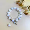 Pulseira de Vidro com Fragmentos de Jade Borboleta Estilo Novo para Mulheres, Pulseira de Girassol de Cristal Colorido Explosivo de Nicho, Em Estoque para Venda no Atacado para Barracas de Mercado