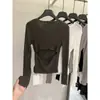 Elegante top de punto de manga larga con botones en la espalda y diseño calado, nuevo estilo de otoño 2026 para mujer, camiseta básica adelgazante con espalda abierta