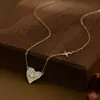 Electrochapado en oro real circón microincrustado cadena para clavícula de temperamento para mujer sensación de alta gama estilo ins collar exquisito collar de amor al por mayor