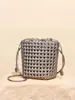 Bolso Tejido Nuevo con Calados Diseño de Nicho Bolso Cubo de Gama Alta Bolso Cruzado de PU Nudo de Molino de Viento Textura Bolso para Teléfono Móvil