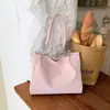 Bolsa feminina de grande capacidade para uso transfronteiriço, nova coleção outono 2026, bolsa de ombro versátil e elegante, bolsa tote moderna e casual para o trabalho e uso diário