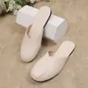 Sandalias tipo chinela plana de talla grande Baotou para mujer, estilo coreano de verano 2025, diseño de patchwork de nicho, suela suave, sandalias de meter fáciles de usar