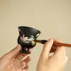 Taza de té de cerámica negra lisa con diseño pintado en oro, pintada a mano, adecuada para uso doméstico, para disfrutar del té y las ceremonias del té