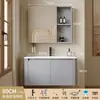 Tocador de baño engrosado y ahorrador de espacio con diseño en color crema, que cuenta con un lavabo redondeado, lavabo cerámico integrado y un lavabo de una sola pieza.