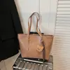 Bolso retro color Maillard 2026 Otoño/Invierno nuevo bolso tote de gran capacidad versátil bolso de mano con textura de alta calidad bolso para el día a día