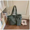 Bolsa de algodón de color liso, simple y elegante, bolso de mano de moda, bolso tote de un solo hombro, para llevar debajo del brazo, nueva versión coreana, primavera 2026
