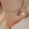 Pulsera de Campana Pequeña Continuada de Jade Hetian Natural Diseño Nicho de Lujo Ligero Elegante Combinable Pulsera para Novia para Mujer en Verano