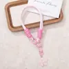 Alça de pulso para celular tecida à mão com fivela dupla, flores de acrílico e pingente de chaveiro com contas, acessório anti-perda