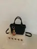 Bolso tipo cubo de tejido de alta gama para mujer, nuevo y elegante, estilo verano chic, de un solo hombro y cruzado