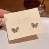 Pendientes de mariposa de cristal de súper hada con explosiones coreanas, pendientes de perlas de temperamento Joker de alta gama para mujer, venta al por mayor