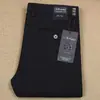 Pantalones de hombre de algodón modal grueso elástico ajustados suaves transpirables para Otoño e Invierno, rectos de cintura media, pantalones casuales de negocios para hombre