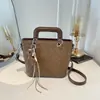 Bolso de cubo de moda con patrón tejido para mujer, nuevo estilo coreano 2026, bolso de mano versátil para salidas diarias y para ir al trabajo, bolso cruzado