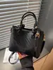 Bolso de mano tejido de otoño transfronterizo para mujer 2026 nuevo diseño de moda bolso de hombro simple bolso cruzado de nicho para el día a día