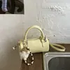 Bolsos de nicho populares transfronterizos 2026 modelo nuevo de primavera bolso de hombro simple versátil bolso cruzado casual bolso cilíndrico