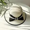 Sombrero femenino verano estilo coreano lazo grande sombrero de paja de playa viaje vacaciones protección solar sombrero para el sol sombrero de paja tejido estilo Chanel tipo cubo