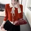 Suéter de punto de manga larga con solapa, nuevo para otoño e invierno 2024, top para mujer, suéter de punto con contraste retro y lazo de encaje