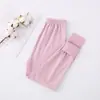 Leggings de uma peça para crianças da CUHK calça de pijama para casa calça interna quente com lixamento dupla face listrada outono e inverno