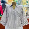 Moda Femenina Transfronteriza Europea y Americana Primavera 2026 Nuevo Estilo Elegante Diseño de Nicho Cuello Camisero Holgado Top de Camisa Rayado