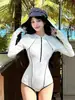 Traje de baño de una pieza de manga larga para mujer, modelo nuevo 2026, talla grande, que cubre el abdomen, adelgazante, para vacaciones en la playa, traje de baño para aguas termales, disponible al por mayor