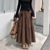 Falda tipo umbrella casual de estilo coreano para principios de otoño, que cubre la cadera, adelgazante, para mujer, falda larga, falda de capas abullonada, negra