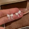 Pendientes de Botón Estilo Coreano Dulce Plata Aguja Circonita Lazo Perla Moda Nicho Versátiles Joyería para Orejas Lujo Ligero Sensación de Gama Alta