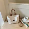 Bolso de hombro de gran capacidad para mujer Shuai Mi Jia, bolso de mano para ir al trabajo, nuevo bolso cruzado simple para estudiante de principios de otoño 2026
