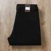 Estación Europea Otoño e Invierno Pantalones de Lana Cálidos Gruesos Sin Planchar Anti-arrugas Hombres Elásticos de Negocios Rectos Casuales