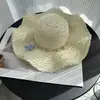 En stock nuevo sombrero de paja Lafite sombrero tejido a mano para mujer salida de verano vacaciones versátil ala ancha protección solar sombrero de playa