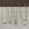 Collar de corazón de perla y circón de lujo ligero estilo francés para mujer, vintage, delicado, moderno, a la moda, versátil para el trabajo, cadena para la clavícula