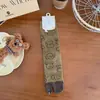 Calcetines de mujer hasta la pantorrilla con dedos separados, con diseño de cachorro de caricatura y estilo sin costuras de dos dedos, adecuados para usar con zapatos que tengan diseño de pata de cerdo o pata de oveja