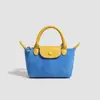 2026 Nova Bolsa de Bolinho Colorida Patchwork de Camurça Bolsa de Mão Versátil para o Dia a Dia Textura Simples Couro Macio Bolsa de Ombro Crossbody