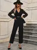 Mono de encaje negro europeo y americano con empalmes para mujer, cuello en V, efecto adelgazante en la cintura, con cortes, manga larga, mono decorativo con cadena metálica