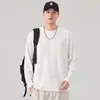 Camiseta de manga larga con cuello redondo y rayas verticales estilo japonés para hombre, corte holgado, texturizada, top casual liso simple para primavera y otoño