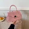 Bolso de mano retro de alta gama con tapa abatible para mujer 2026 nuevo bolso cuadrado pequeño con cierre simple para el trabajo de un solo hombro cruzado bolso de mujer
