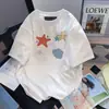 Seda de Leite 2026 Verão Nova Camiseta com Gola Redonda e Manga Curta Estrela do Mar Unissex Estilo Americano Tops de Manga Curta para Casal Tendência