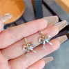 Pendientes coreanos de nuevo estilo con lazo para mujer, Pendientes de botón de circón y perla de nicho de lujo ligero de moda