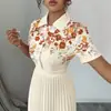 2026 Nuevo Vestido Camisa Vintage Europeo y Americano de Retazos Florales Naranjas con Cuello de Solapa, Mangas Cortas, Ceñido a la Cintura, Falda Larga Plisada