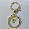 Atacado de fábrica fivela lagosta liga de zinco dourado claro conjunto de três peças com corrente chaveiro de metal com fivela de 8 palavras Pingente de joia