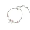 Pulsera de encaje hueco con lazo puramente deseable para niña, diseño de nicho para mujer, extremadamente hermosa y con sensación de alta gama, cadena de mano y joyería