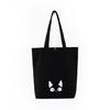 Venta al por mayor de fábrica en stock caricatura portátil bolsa de hombro para compras simple broche algodón negro bandolera lona